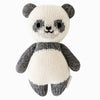 A Cuddle + Kind Baby Panda with a white and gray body, featuring black eye patches and a cute smiling face.