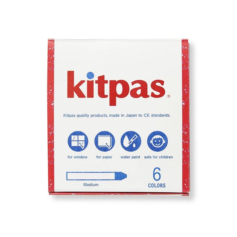 The image displays a package of Kitpas Crayons - 6 Colors in medium size, emphasizing six vibrant hues. The packaging indicates that these non-toxic crayons are ideal for use on windows, paper, and watercolor painting, making them safe for children. The backdrop is white with red and blue text.