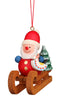 This Christian Ulbricht ornament elegantly features a cheerful Santa Claus figure on a wooden sled. With a small toy in hand and accompanied by a miniature Christmas tree, it’s beautifully crafted in Germany and suspended by a delicate red string.