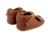 A pair of small, brown Donsje Baby Bear Shoes with Velcro fastening straps, displayed against a black background.