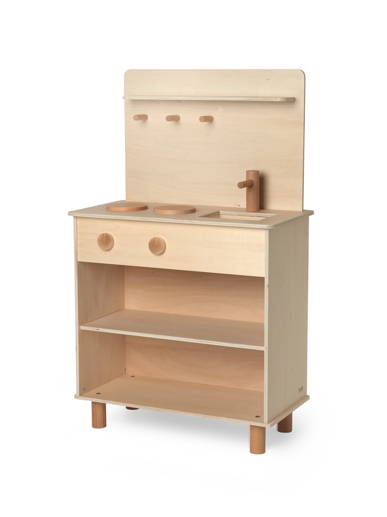 A Ferm Living Toro Play Kitchen set featuring a stove, sink, shelf, and hooks, isolated on a white background.