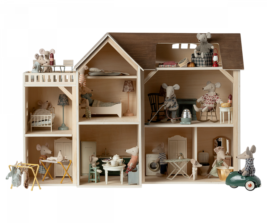 A detailed Maileg Farmhouse dollhouse with various rooms decorated with miniature furniture and small animal figurines engaging in everyday activities, featuring a neutral color palette.