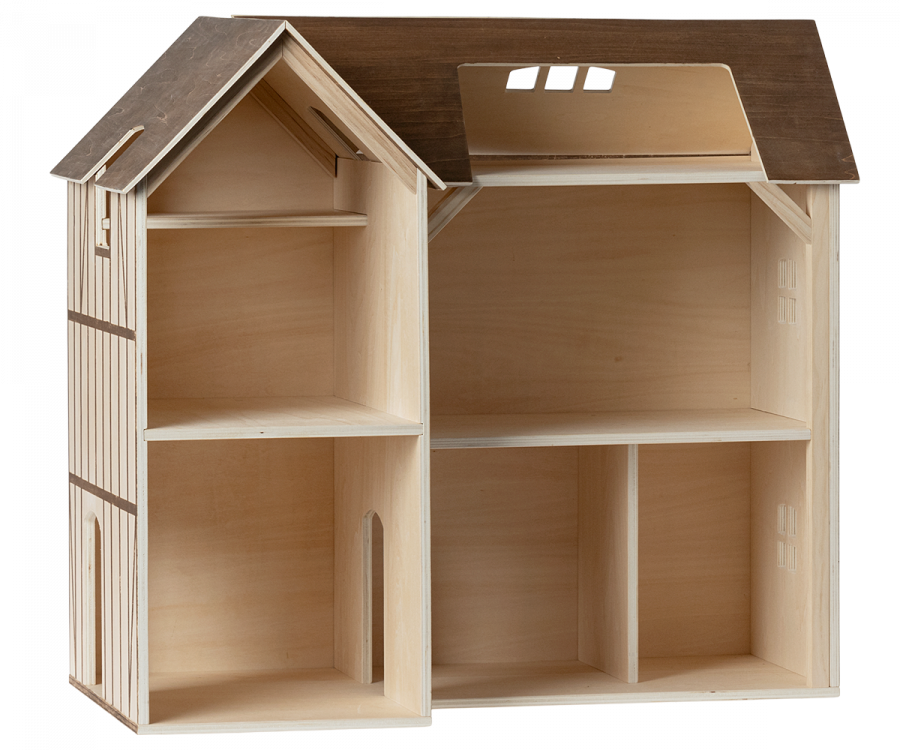 An empty wooden Maileg Farmhouse Dollhouse with an open back, featuring multiple rooms and a detailed exterior, including windows and a shingled roof.