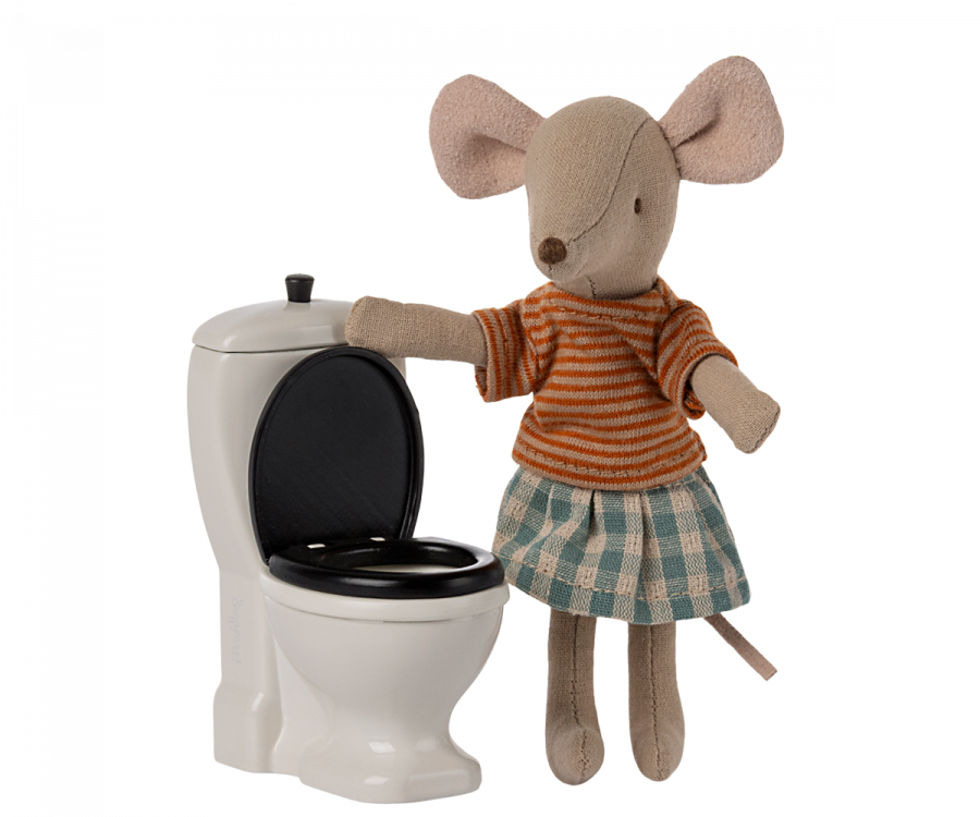 White mini toilet with black toilet. Fabric mouse with striped orange shirt and blue and white skirt. 