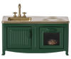 A miniature Maileg Kitchen - Dark Green with a golden countertop, featuring a sink, stove, and an oven with a visible loaf of bread inside.