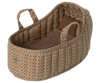 The Maileg Carry Cot, Large - Sand is a cozy and quilted portable bed adorned with a subtle brown floral pattern and equipped with handles for effortless carrying. Inside, it includes a neatly folded, brown knitted blanket that enhances both warmth and style.