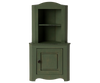 The Maileg Large Corner Cabinet in dark green is a stylish home decoration piece, featuring an upper open shelf section and a lower section with a single door that includes a knob. It showcases a slightly distressed finish for vintage charm, making it perfect for fitting into any corner space.