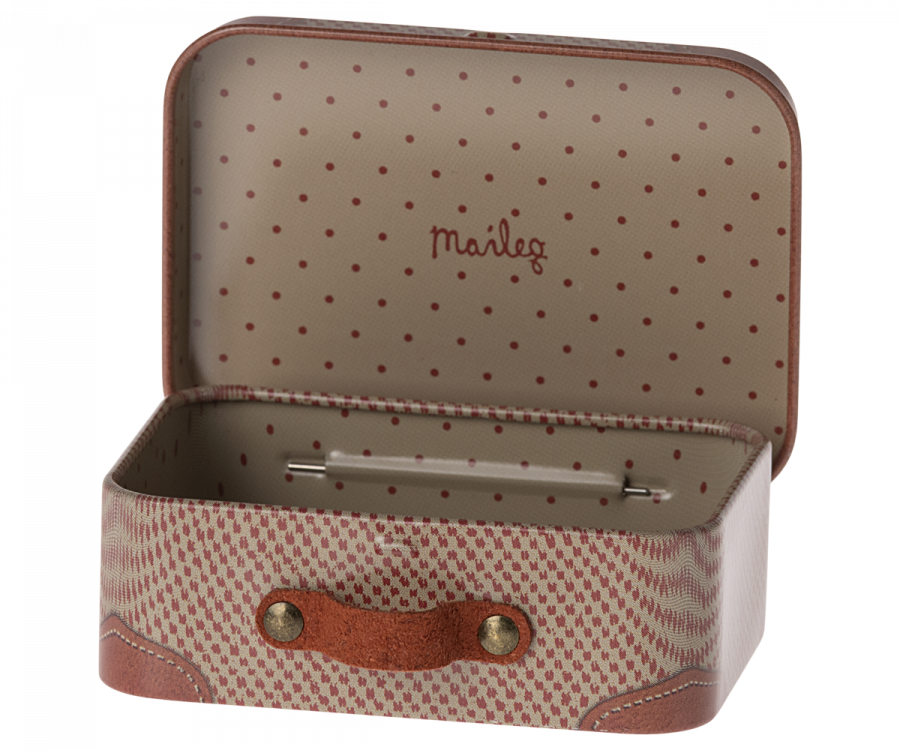 The Maileg Suitcase, Micro is a small, open rectangular suitcase with a brown exterior and a dotted beige interior, ideal for storing small items. It features a light brown leather handle secured with two metal rivets on each side. The inside of the lid displays colorful illustrations and the text "Maileg" in red.