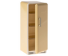 A miniature, vintage-style yellow fridge perfect for a Maileg dollhouse, with its door slightly open to reveal three empty wire shelves inside. The fridge has a simple, sleek design with the word "MAILEG" embossed near the top.