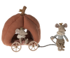 A soft fabric toy set featuring the Maileg Pumpkin Carriage: a mouse dressed as a princess sitting inside a plush, fairytale carriage shaped like a pumpkin with wheels. Another mouse, in a regal outfit, pulls the carriage by a rope, both wearing tiny crowns fit for royalty.