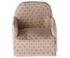 The Maileg Chair, Mouse - Dot is a small, beige upholstered armchair adorned with red polka dots, ideal for lounging in a cozy corner of your Gingerbread House.