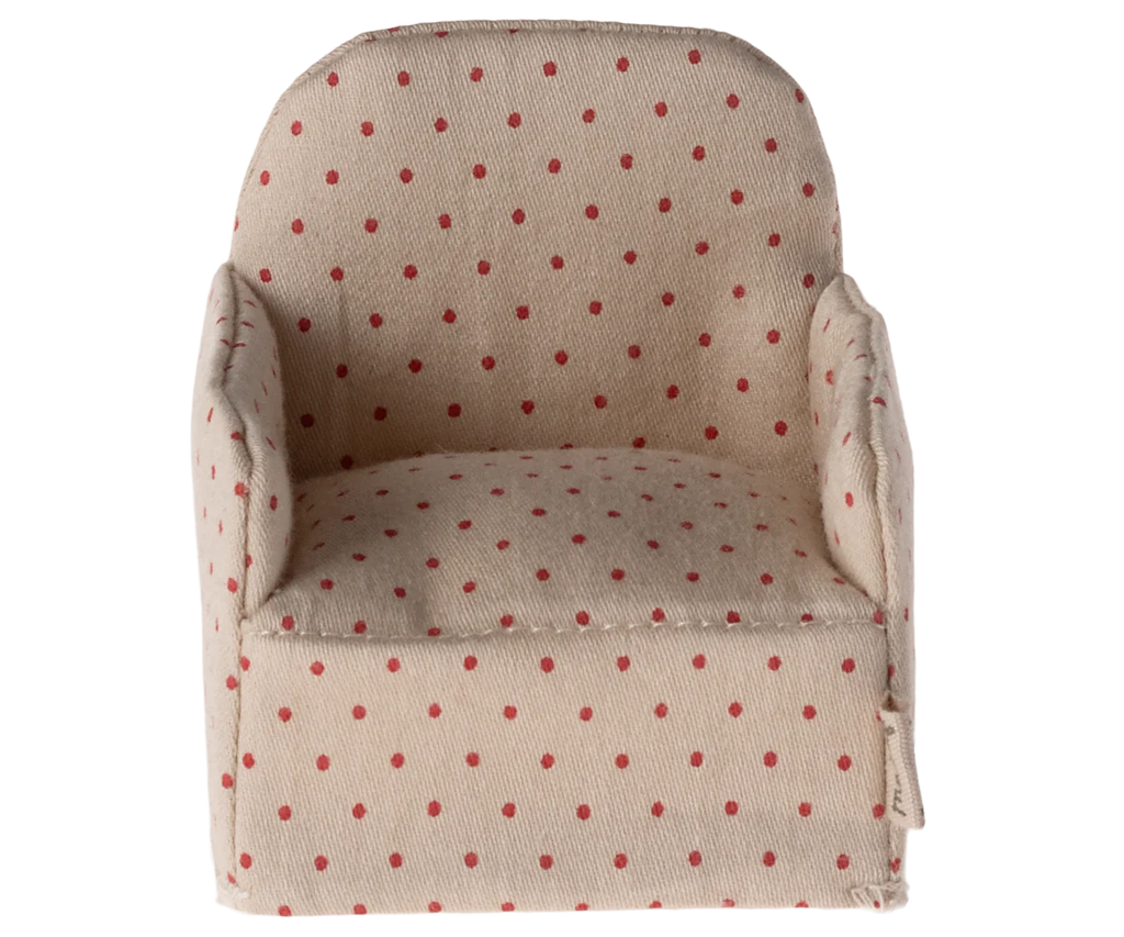 The Maileg Chair, Mouse - Dot is a small, beige upholstered armchair adorned with red polka dots, ideal for lounging in a cozy corner of your Gingerbread House.