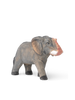 A Hand Carved Wooden Elephant with a blurred, stretched background effect on one side, standing isolated on a white backdrop.