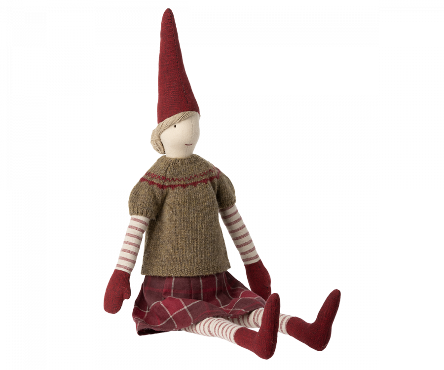 The Maileg Christmas Maxi Pixy is a charming cloth doll from the Maxi Pixies collection. It showcases a pointed red hat, a green knitted sweater, and a plaid skirt. With its striped legs and red mittens, this festive decoration is crafted from exclusive materials to enhance its whimsical appeal. The minimal facial details contribute to its endearing charm.