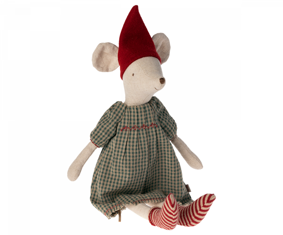 A Maileg Medium Christmas Mouse - Girl wearing a red pointed hat, green and beige plaid dress, and striped red and white leggings, sitting isolated against a black background.