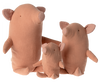 Three Maileg Truffles the Pig toys of varying sizes sit together, resembling a family of truffles. Each adorable pig is light pink with small pink ears and matching snouts. The stuffed animals feature simple, stitched eyes and slightly tilted heads, giving them a whimsical and endearing appearance.