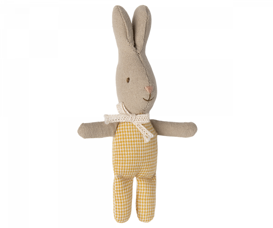 A Maileg My Rabbit - Yellow toy with beige fabric, wearing a yellow and white checkered outfit. It has a white polka-dotted bow around its neck, with arms extended sideways and a stitched face showing a small, gentle smile—perfect for any rabbit family or as one of your must-have accessories.