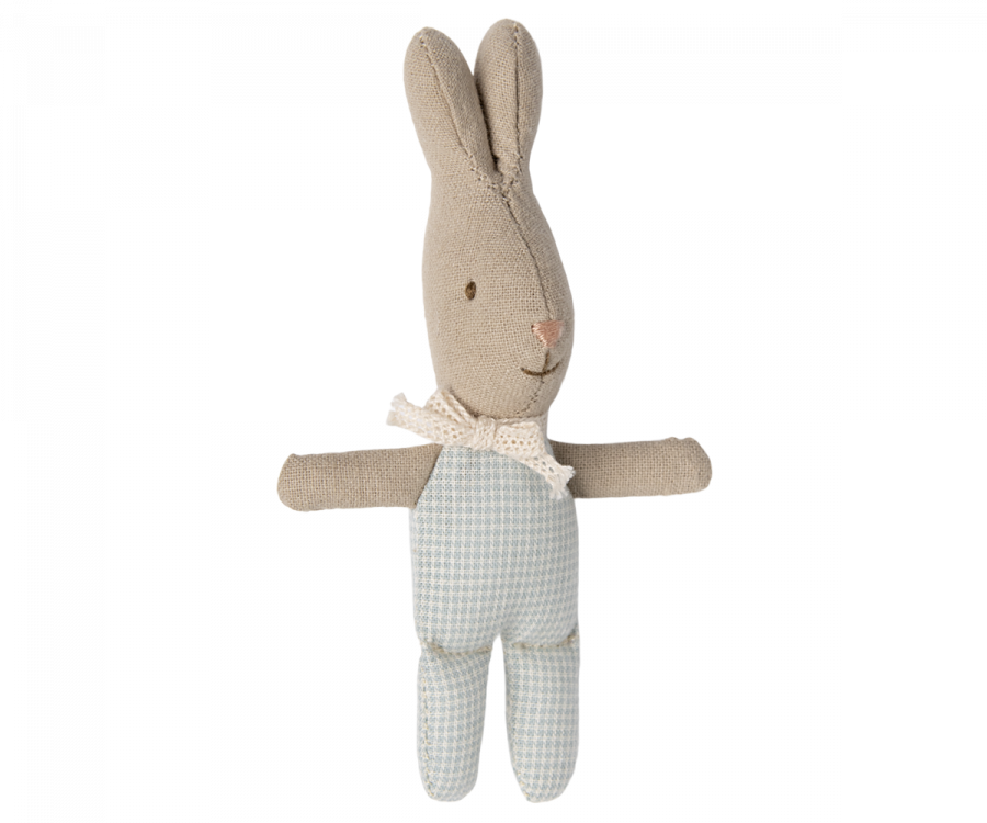 The Maileg My Rabbit - Blue is a charming stuffed bunny doll with beige fur and long ears. It wears blue and white gingham overalls and a white polka dot scarf around its neck, making it the perfect addition to add charm to a nursery table with its adorable rabbit accessories.