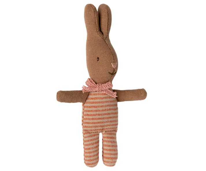 Introducing the Maileg My Rabbit - Stripes, a plush bunny made from soft brown fabric and adorned with a charming pink bow tie. This delightful rabbit boasts embroidered eyes and nose, complemented by charming striped orange and white legs. It's perfect for adding a whimsical touch to any cozy nook!