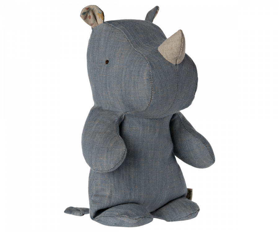 A worn, blue denim fabric Small Maileg Rhino stuffed toy with visible stitching and soft fabric horns, part of a safari friends collection, standing against a black background.