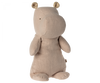 A Maileg Medium Hippo Stuffed Animal - Light Rose, made from the softest recycled polyester, stands on its hind legs with small dotted ears. The toy has a smooth texture and minimal facial features, giving it a simple, yet cute appearance — perfect for joining your Safari friends collection.