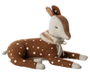 A soft, plush Maileg Cosy Bambi Deer in off-white fur with delicate white spots. It features a light beige face and inner ears, closed eyes adorned with embroidered eyelashes, and a white fuzzy collar around its neck. This classic toy is lying down with legs outstretched.