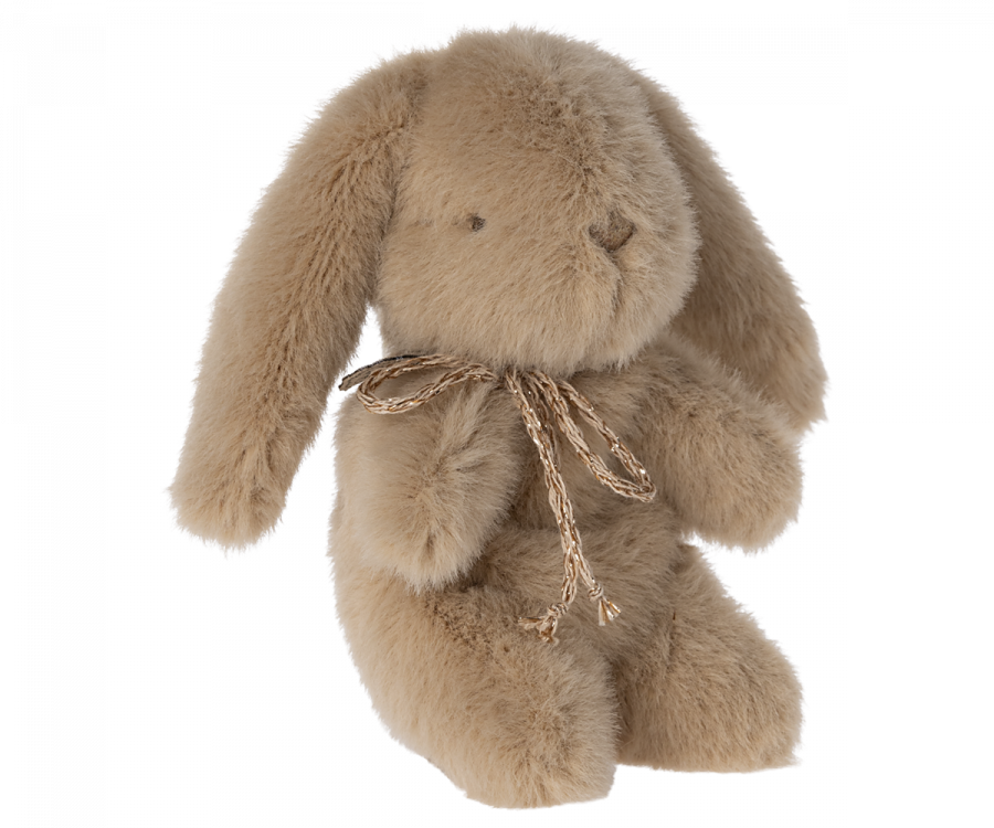 Mini cream peach colored plush bunny with bow around its neck. 