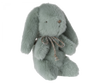 A soft, plush Maileg Mini Plush Bunny - Mint toy with long ears and a decorative brown string tied around its neck, isolated on a white background.