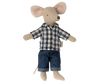 A plush toy mouse is dressed in a charming blue and white plaid shirt paired with blue denim pants. This adorable mouse, featuring light beige fur, large ears, and a long tail, is part of the "Maileg Extra Clothing: Clothes For Dad Mouse" set.