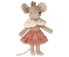 A Maileg Princess Little Sister mouse, adorned with a gold crown and wearing a pink ballet tutu, stands upright against a matchbox background.