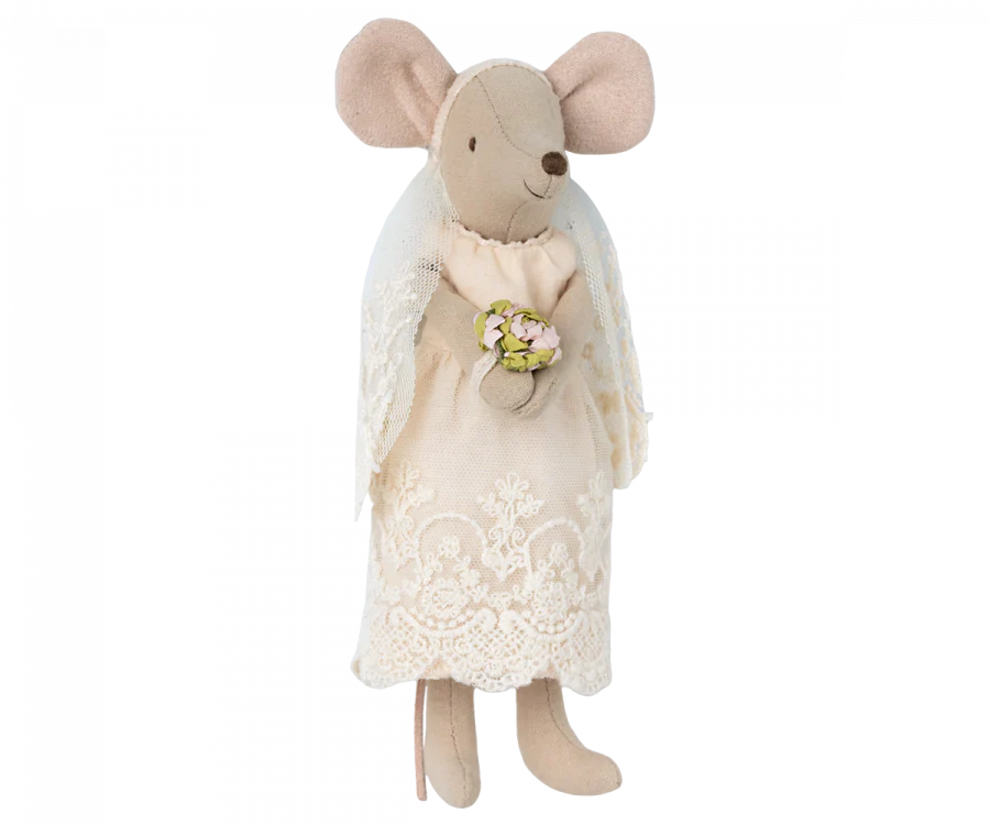 A Maileg Wedding Mice Couple in Box wearing a white lace wedding dress and holding a small bouquet of flowers, isolated on a black background.