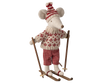 The Maileg Winter Mouse with Ski Set, Mom - Red features an adorable stuffed mouse toy adorned in a red and white knitted sweater, patterned pants, and a matching hat, all while standing on wooden skis as part of the winter toy collection.