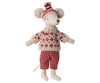 Introducing the Maileg Winter Mouse with Ski Set, Mom in Red: this delightful winter toy is a stuffed mouse dressed in a snug knitted sweater featuring red and beige patterns. It comes with coordinating checkered pants and a cozy knitted hat topped with a pom-pom, making it an ideal addition to any mouse playset for the chilly season.