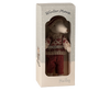 Inside a decorative box, a charming plush Maileg Winter Mouse dressed in a cozy woolen sweater and plaid pants is displayed alongside its ski set. The top of the box is labeled "Winter Mouse" while "Maileg" appears at the bottom. The window offers a glimpse into this enchanting toy, perfect for enhancing any mouse playset.