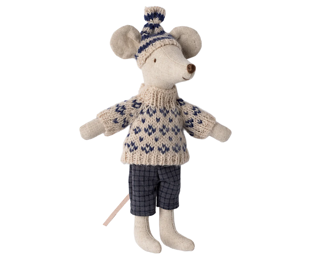 The Maileg Winter Mouse with Ski Set, Dad - Blue features a toy mouse dressed for winter in a cozy knitted sweater with a blue and white pattern, complemented by blue checkered pants and a matching knit hat. The mouse stands upright, poised for its ski adventure, with its long tail trailing behind.