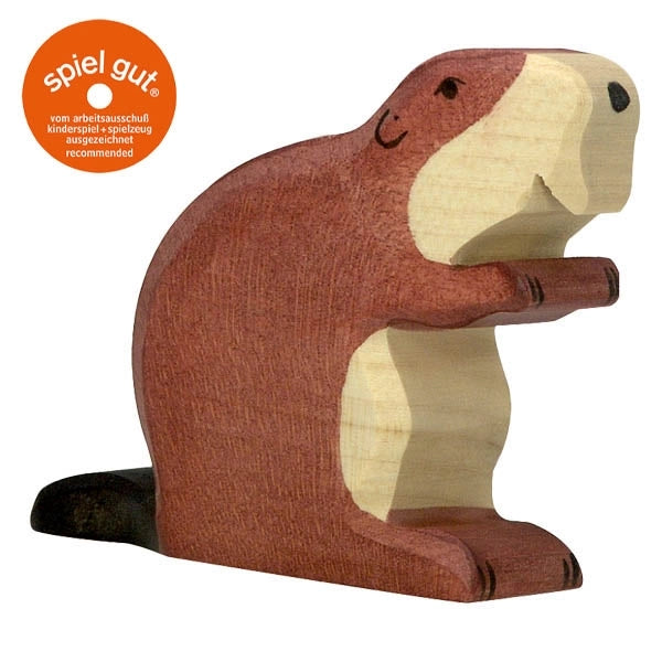 A handcrafted wood toy beaver with a smiling face and a "spiel gut" certification symbol in the top left corner. This charming Holztiger Beaver boasts a brown body with a light-colored belly and front paws, standing proudly on its hind legs. Made in Europe, it exudes quality craftsmanship.