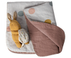 A mustard-yellow plush rabbit toy with long ears and a small cloth backpack rests on the Maileg Small Blanket - Rose. This cozy nursery essential features pastel-colored polka dots on one side and plain mauve, crafted from soft linen fabric, on the other.