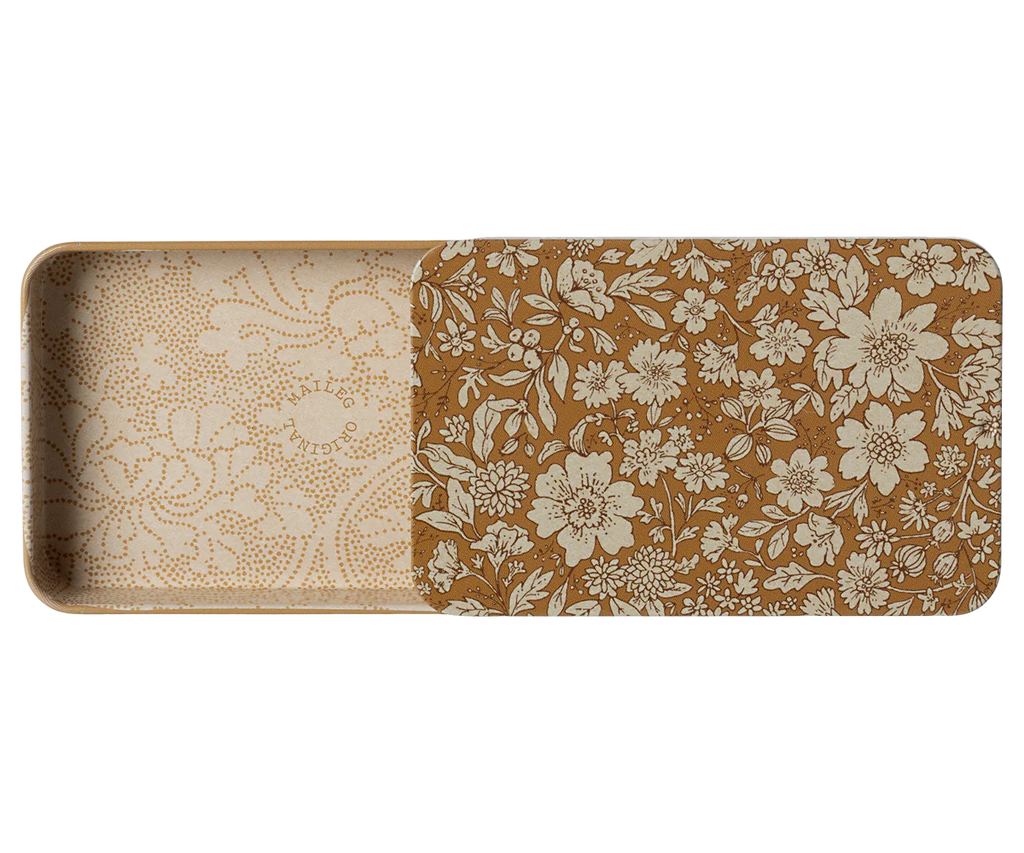 The Maileg Metal Box with Sliding Lid is a rectangular metal container adorned with an intricate white floral pattern on a brown background. The inside of the lid reveals delicate white floral designs on a light beige background, making it ideal for use as a storage box or for holding gift cards.