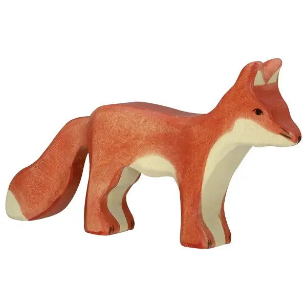 A high-quality, hand-carved wooden Holztiger Fox, Standing with a reddish-brown body and white underbelly. This handcrafted HOLZTIGER figure features a bushy tail, pointed ears, and a small black eye, standing on four legs and facing to the right.