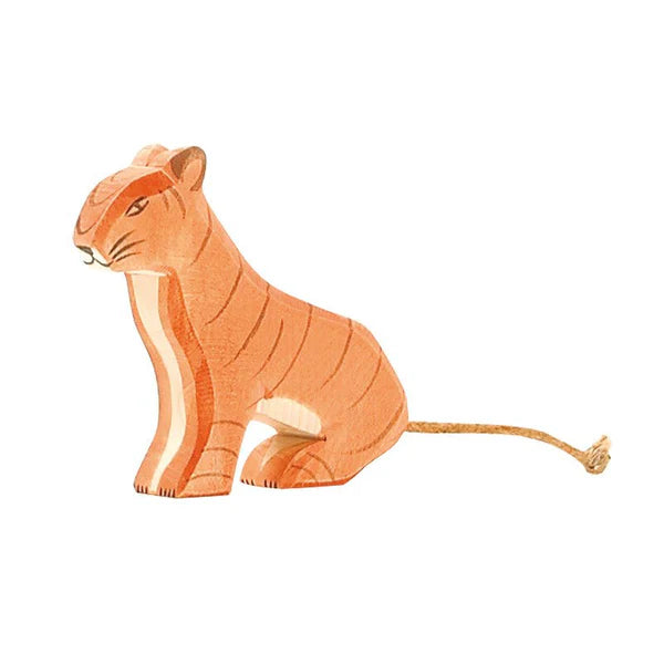 A small handcrafted Ostheimer Sitting Tiger with orange and white stripes. The tiger is sitting with its head slightly turned, showcasing its serene facial expression. A thin rope tail is attached at the back, making it an ideal piece for imaginative play.