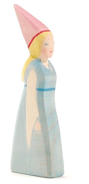 The Ostheimer Daughter of the Castle is a wooden figurine depicting a princess with long blonde hair. She wears a light blue dress and a tall pink conical hat, adorned with a red band at its base. Perfect for imaginative play, the princess stands upright and faces slightly to the right.