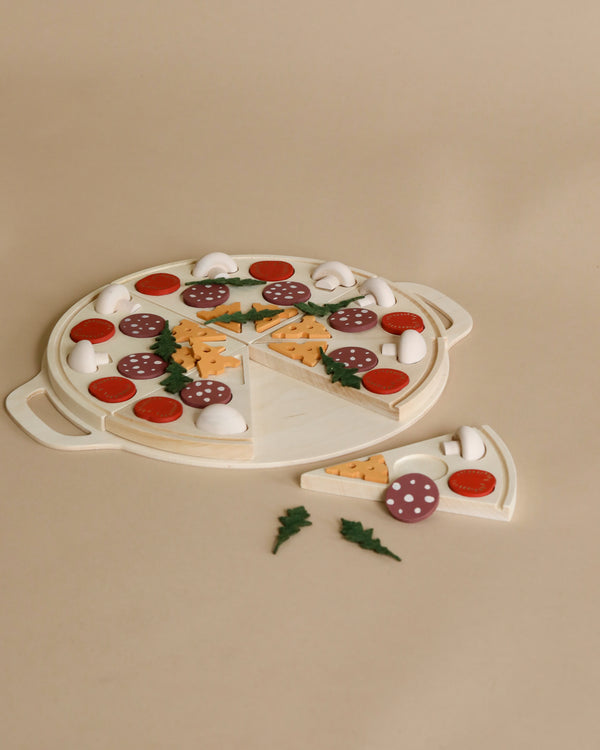 A Sabo Concept Wooden Pizza toy with slices featuring toppings like mushrooms, pepperoni, and cheese on a tan background, shaped markers on crust to suggest slice divisions.