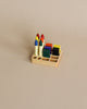 A Crayon Tray For Stockmar - 8 x 8 Slots featuring six colorful ink pads and five Stockmar sticks neatly arranged on a beige background.