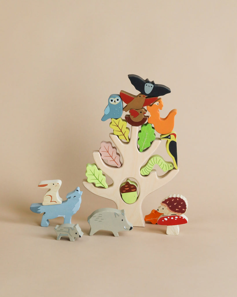 A colorful wooden Stacking Forest puzzle for children, featuring assorted colored animal and nature-themed pieces against a plain beige background.