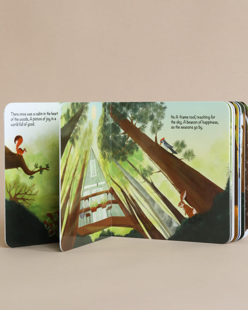 An open illustrated The Happy A-Frame In The Woods Book with an image showing a cabin in a lush forest. The left page narrates the beginning of a children's bedtime story, while the right page depicts a vertical view of trees and.