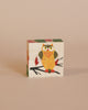 A Wooden Block Puzzle - Mini 4 Piece Domestic Animals assembled to form the image of a colorful owl with wide eyes on a soft beige background.