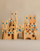 Wooden castle toy with gem inserts