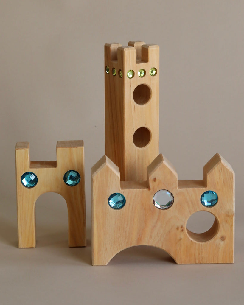 Wooden castle toy with gem inserts