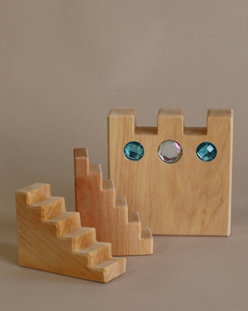 Wooden castle toy with gem inserts