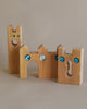 Wooden castle toy with gem inserts